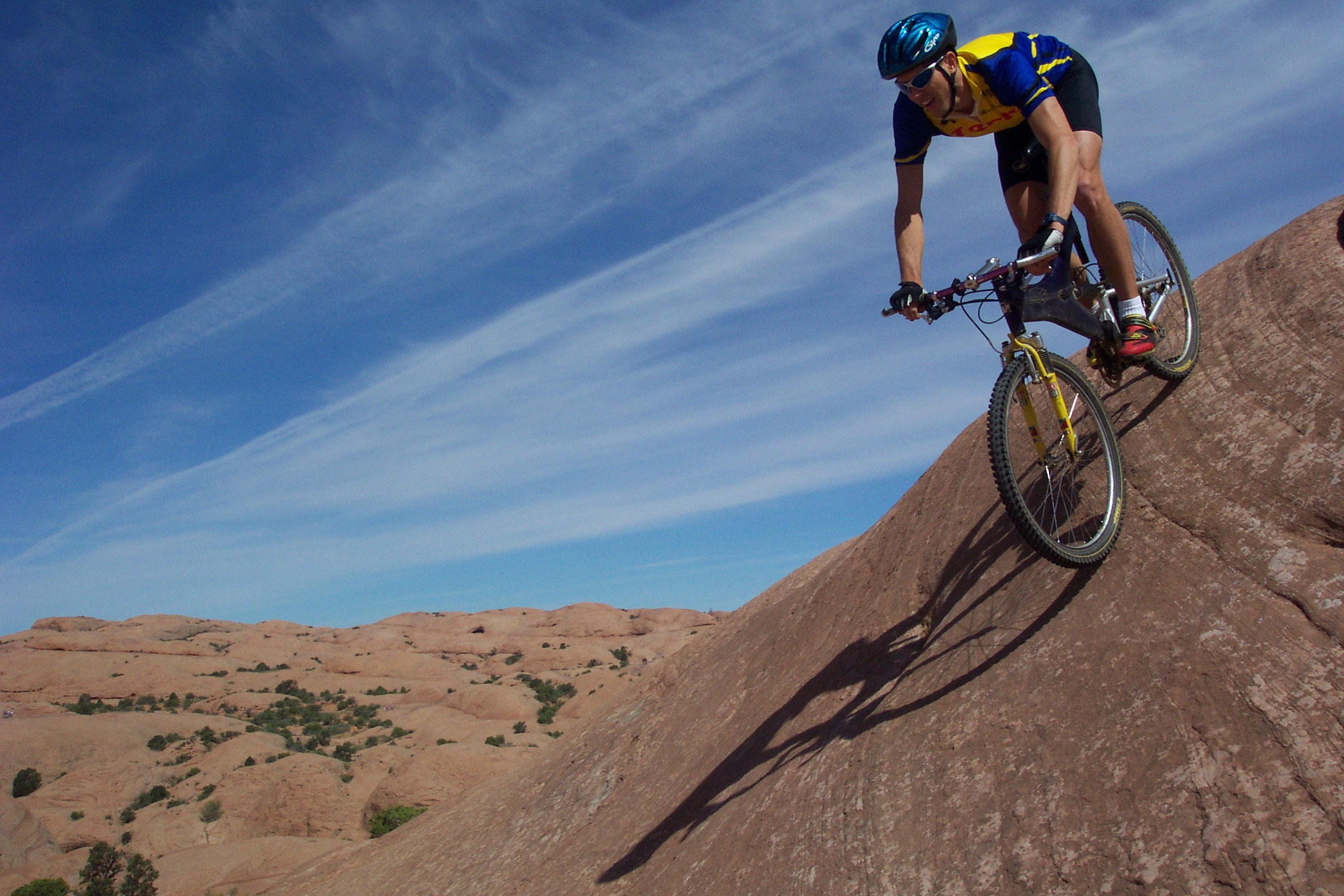 Biker riding down mountainside